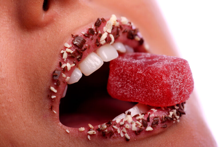 a woman mouth with candy inside